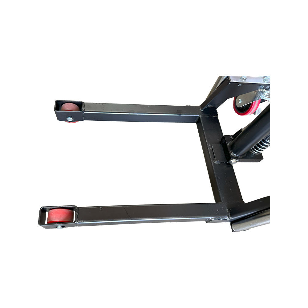 Close-up of a black equipment base with red wheels, showcasing a sturdy frame and swivel mechanism for mobility.