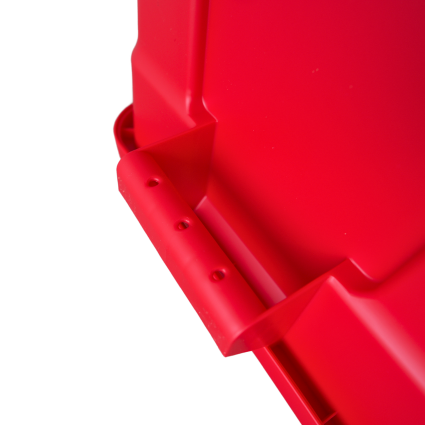 Close of of an upside down red storage container showcasing the underneath of the handle grip.