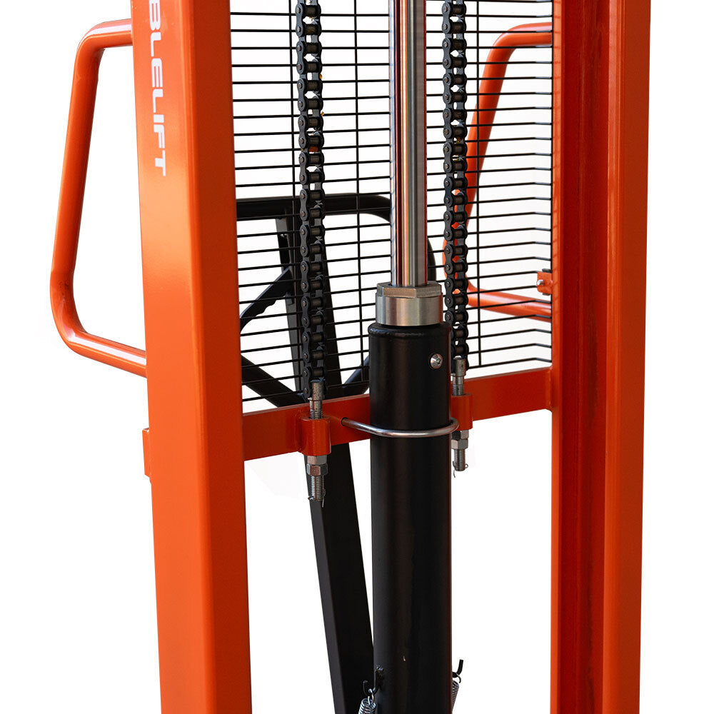 Close-up of a heavy-duty lifting machine with orange frame, hydraulic cylinder, and chain mechanisms, designed for lifting and moving loads.