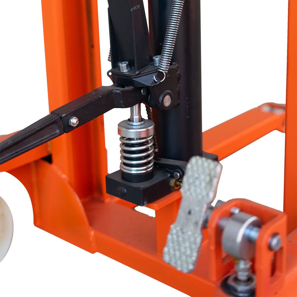 Close-up of a hydraulic lift mechanism showing springs, levers, and a foot pedal, all designed for lifting heavy loads safely.