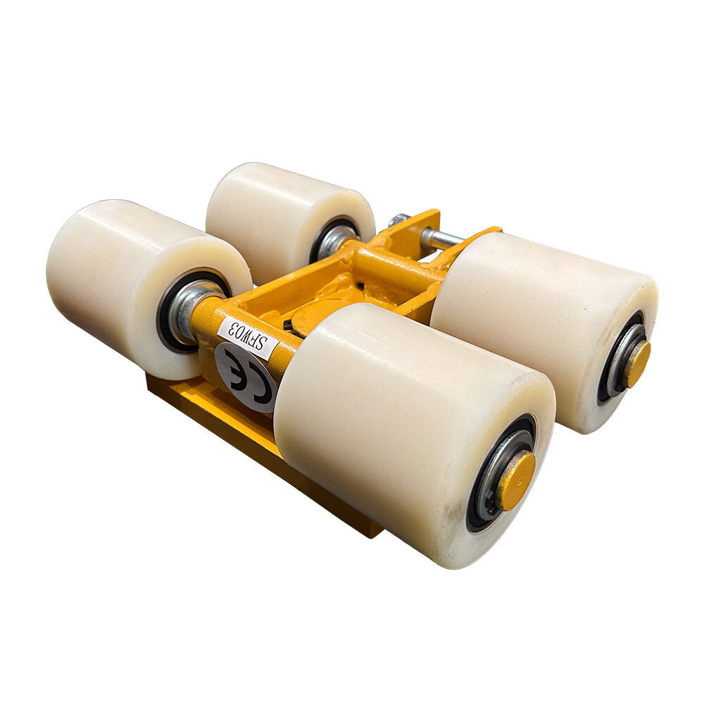 A close-up of a yellow skateboard truck with four white wheels, showcasing its sturdy design and smooth bearings.