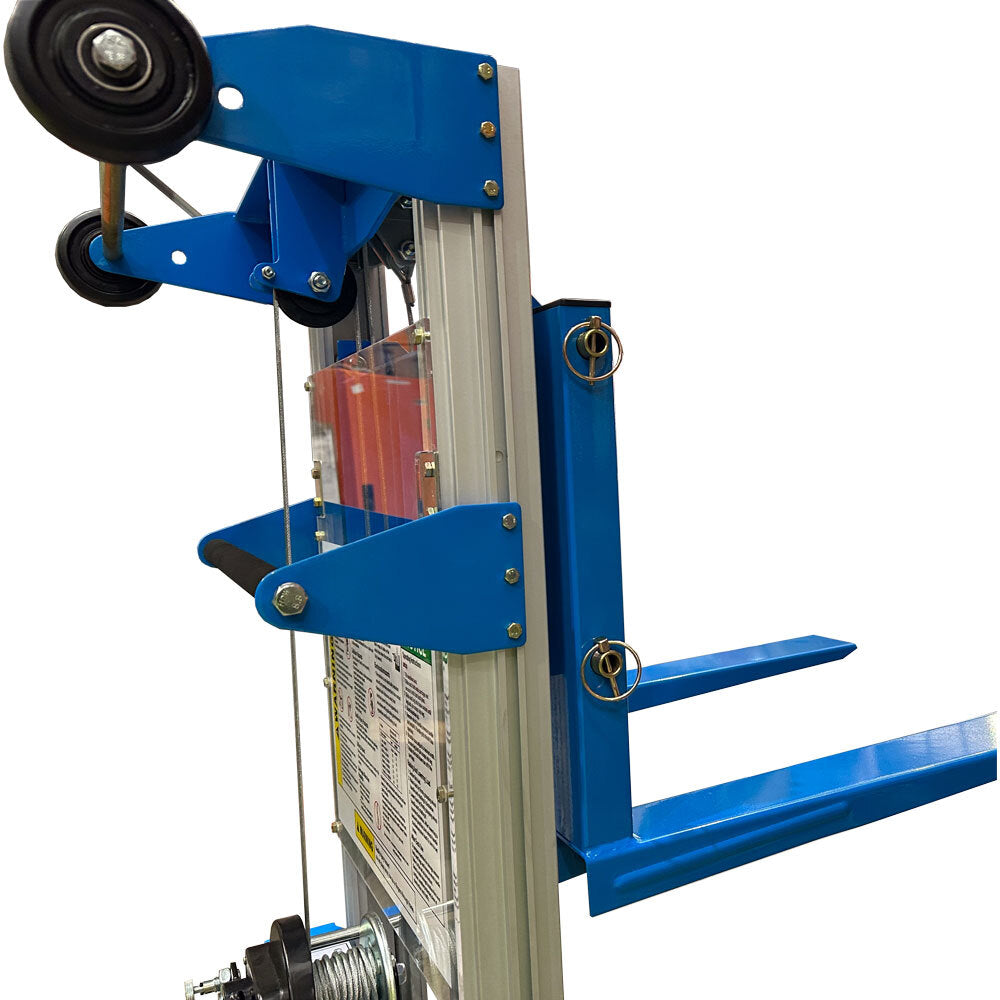 Close-up of a blue manual hand stacker device with wheels, a handle, and forks, designed for transporting heavy items.