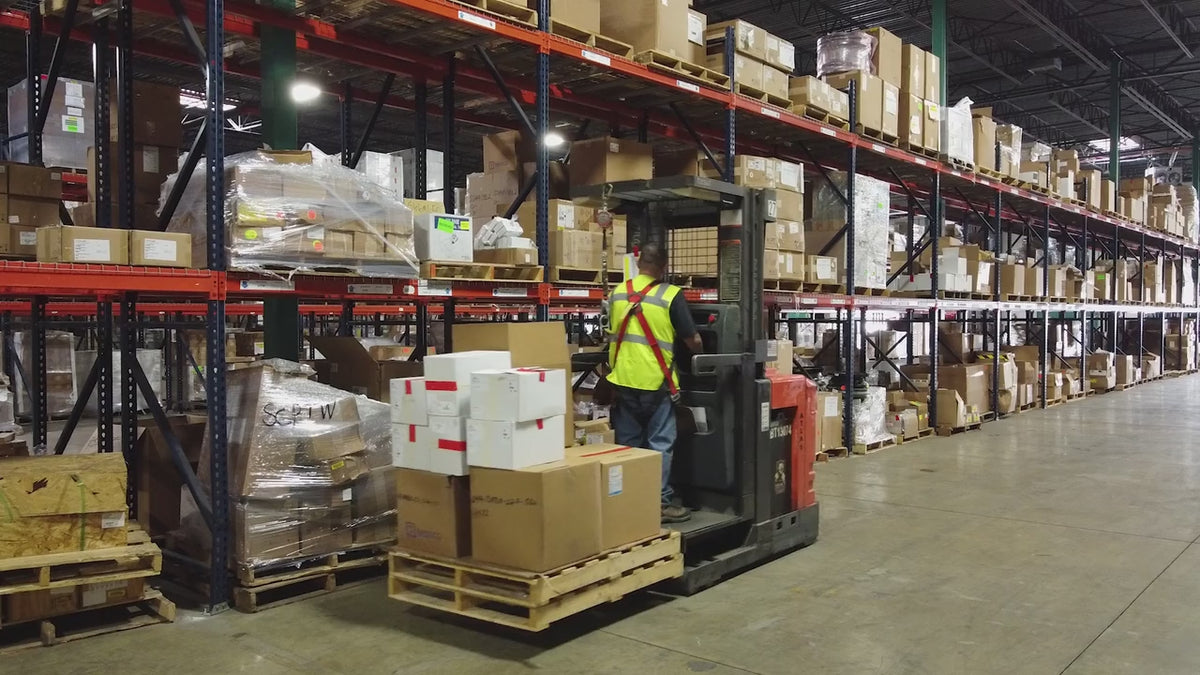 Warehouse equipment in use and container operations at the Port of Melbourne.