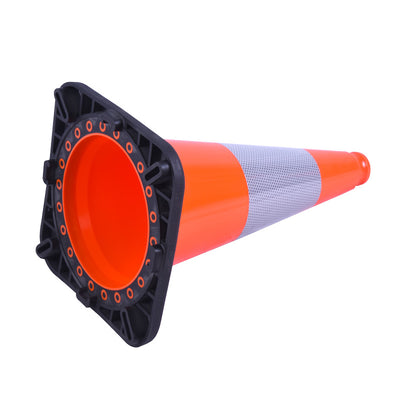 Close-up of an orange traffic cone with a black base and reflective stripe, angled to show its hollow interior.