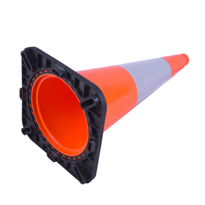 Close-up of an orange traffic cone with a black base and reflective stripe, angled to show its hollow interior.