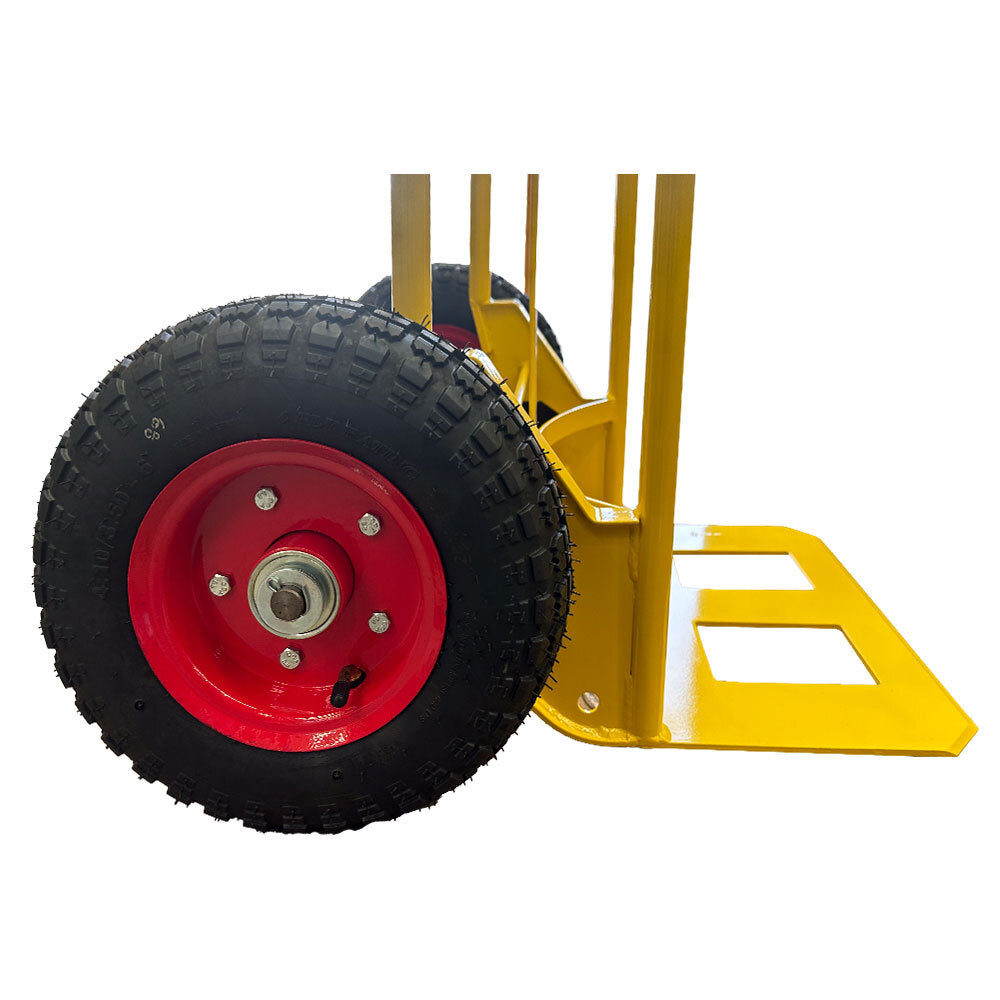 Close-up of a sturdy yellow hand truck with a red wheel, showcasing the textured tire and metal frame design for durability.