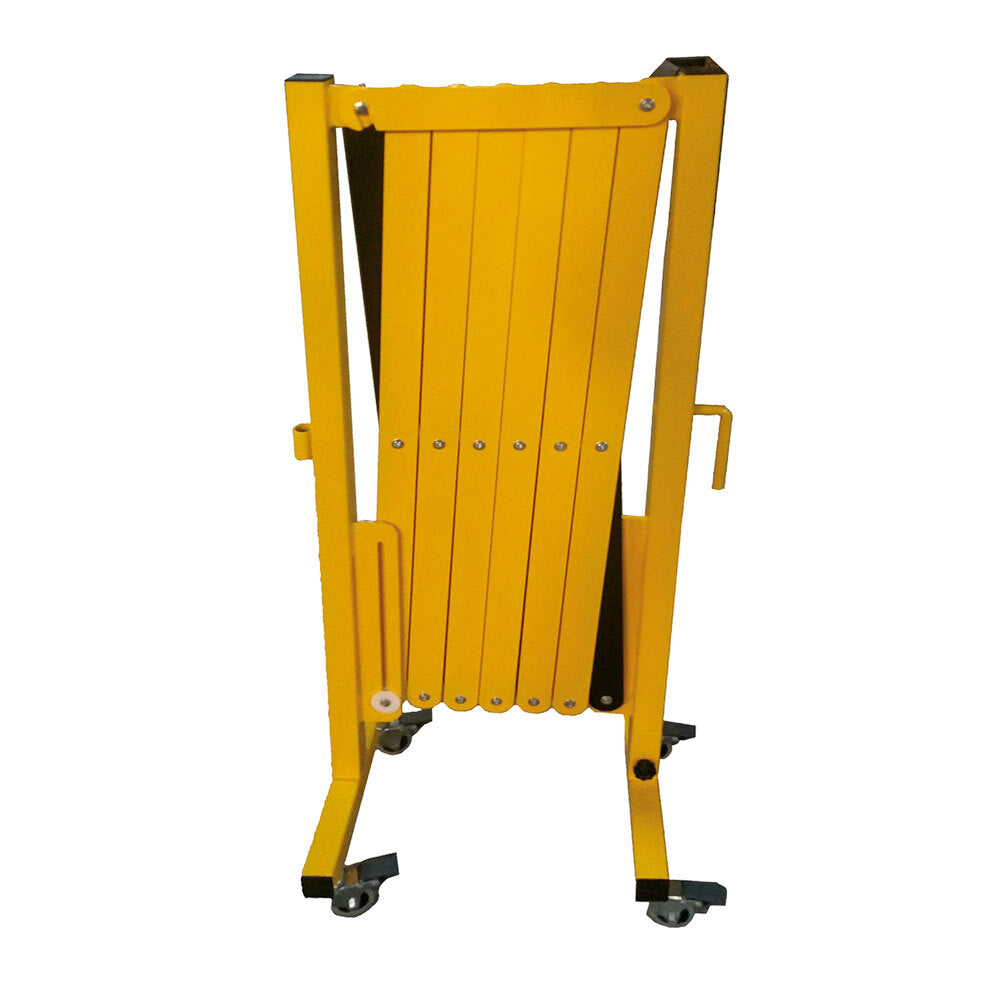 A yellow and black retractable safety barrier, designed to block access, with a zigzag pattern and wheels for mobility.
