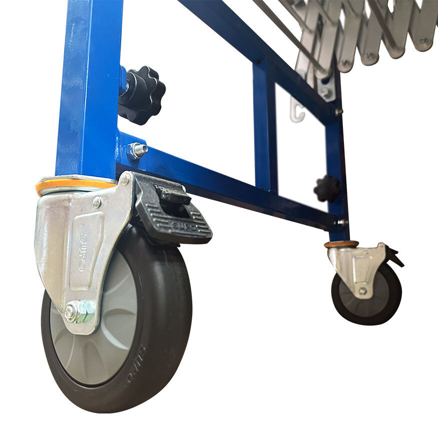 Close-up of a blue conveyor's caster wheel with a locking mechanism.