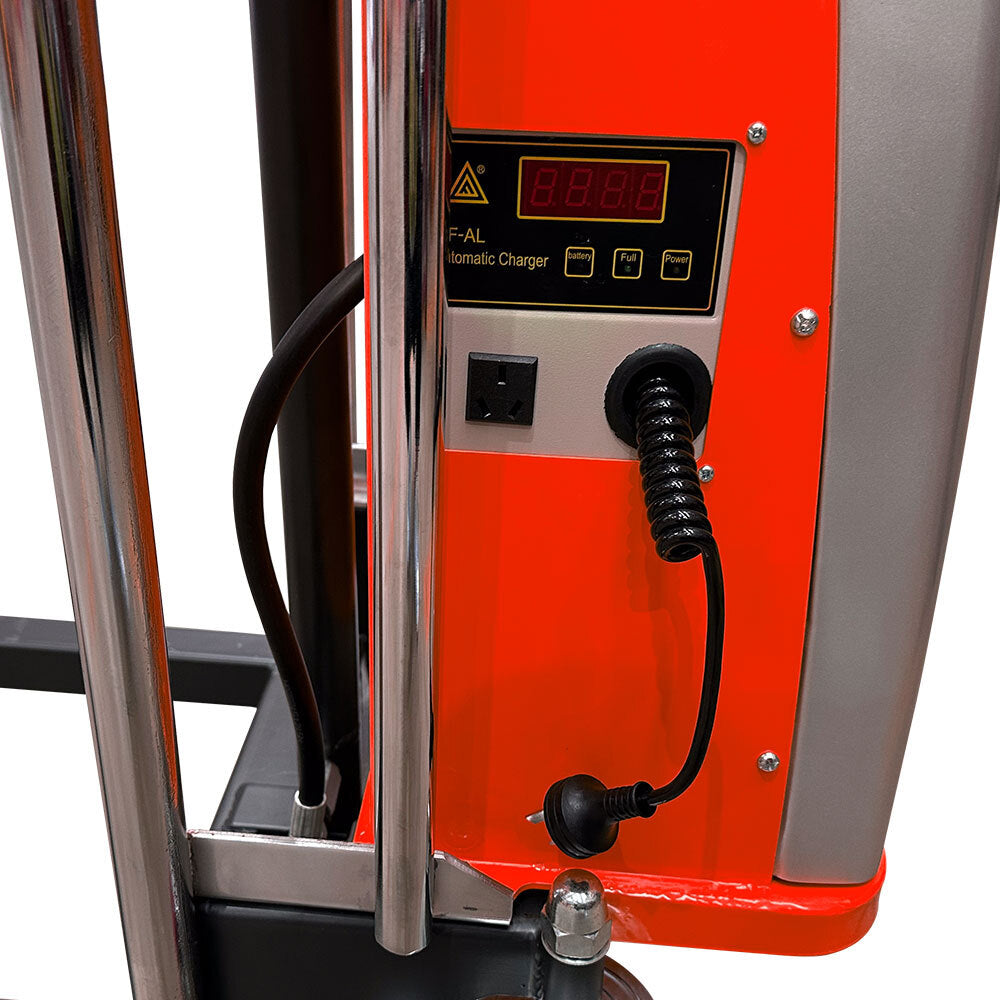 Close-up of an electric charger panel on a machine, featuring a digital display and connection ports against a bright background.