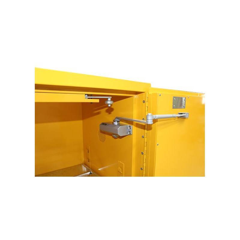 Close-up of a bright yellow storage cabinet door with a hydraulic hinge mechanism and a secure latch.
