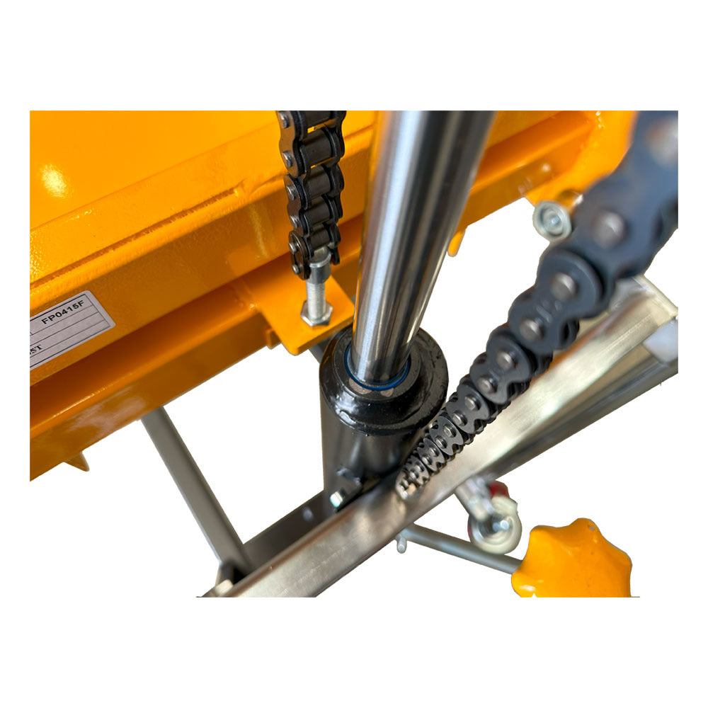 Close-up of a mechanical assembly featuring a shiny steel rod, black rubber seal, and a chain drive, against a bright yellow background.