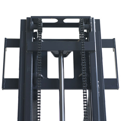 Close-up view of a forklift's mast, featuring chains and hydraulic components for lifting heavy loads.