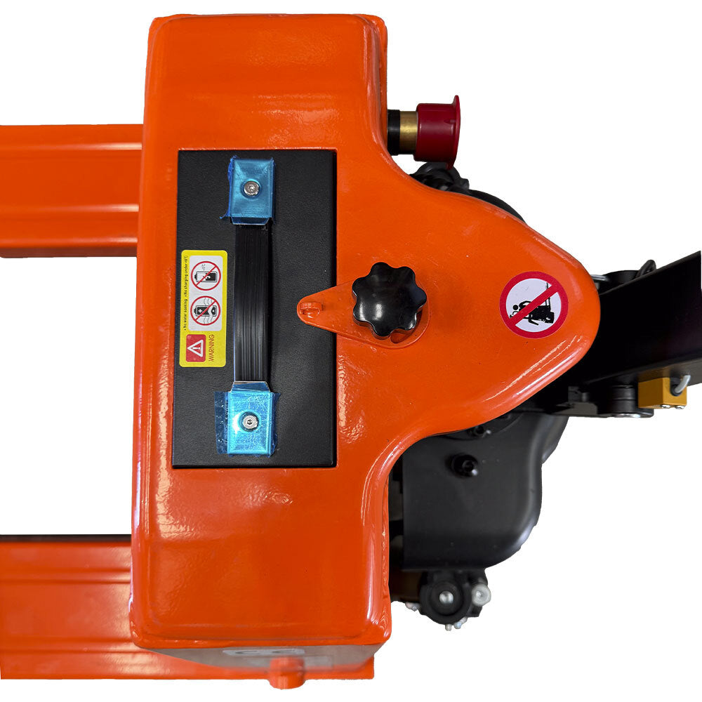 Top view of an orange industrial machine control panel featuring buttons, warning signs, and adjustment knobs.