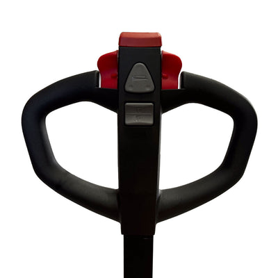 Close-up of a pallet jack handle with ergonomic grips and control buttons for forward and reverse movement.