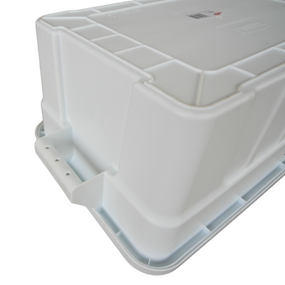 Close of of an upside down white storage container showcasing the underneath of the handle grip.