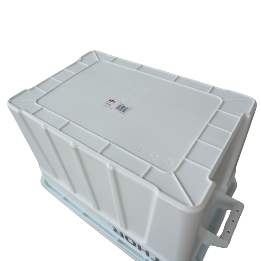 A view of the underside of a white plastic storage container with a label, featuring a textured base for grip and built-in handles.