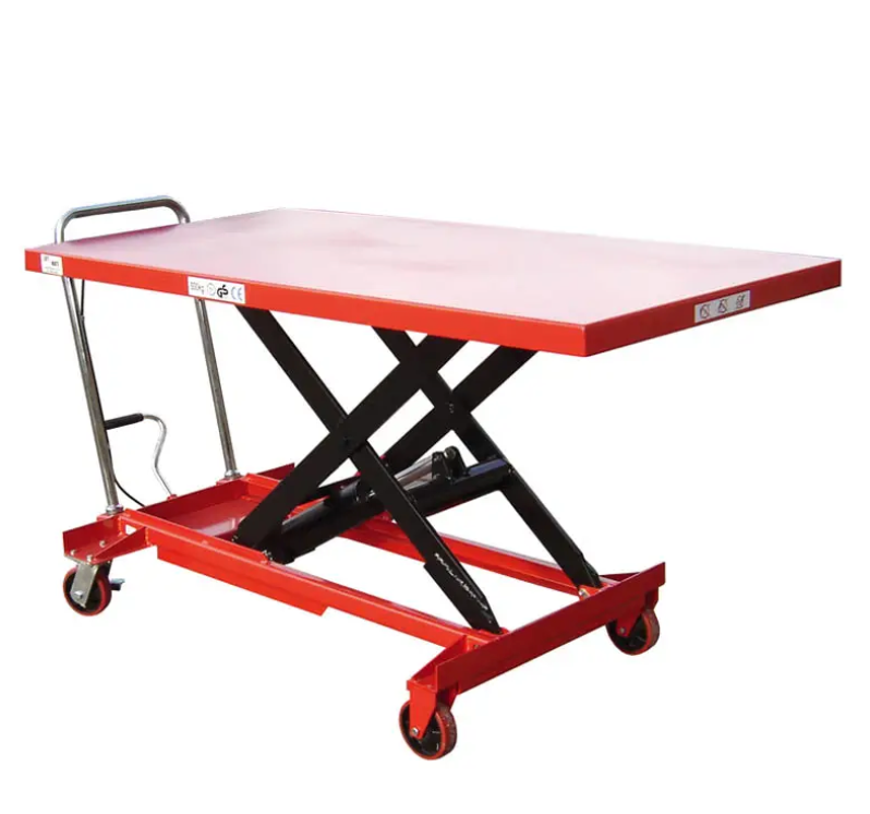 Red scissor lift table with a flat top and movable casters, designed for elevating heavy items safely.